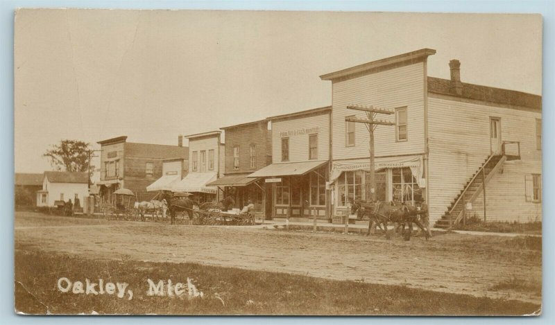 Postcard MI Oakley Michigan c1912 Main Street View Stores RPPC Real Photo AD12