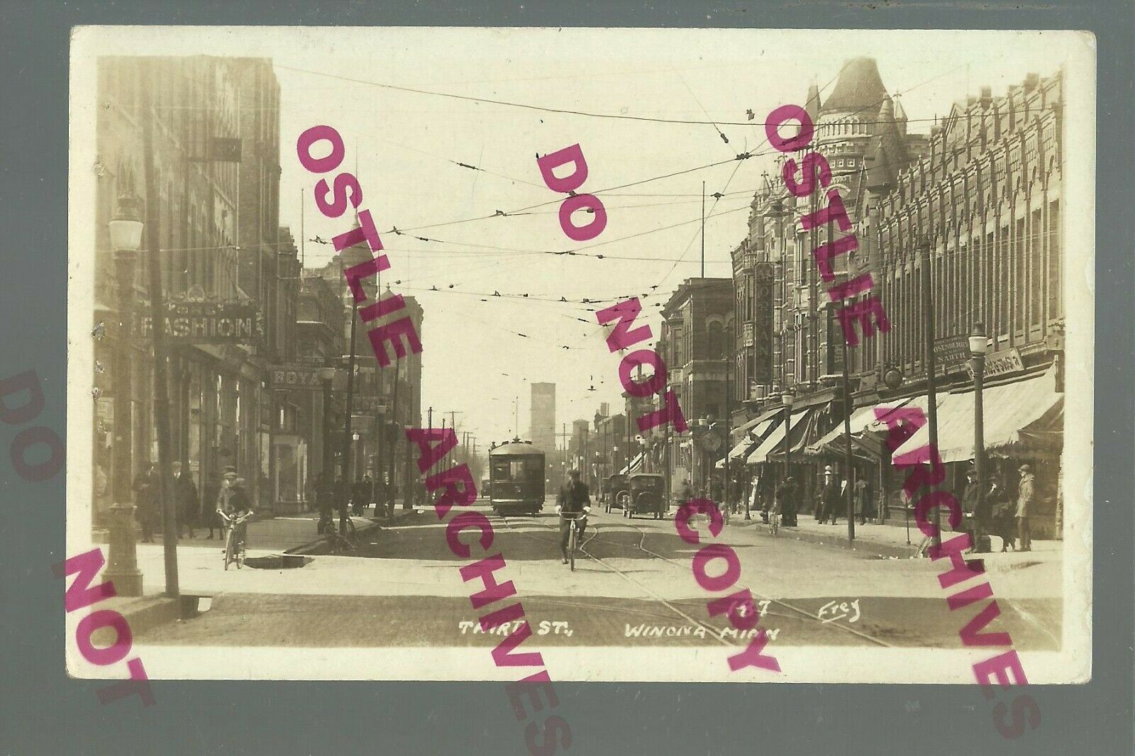 Winona MINNESOTA RPPC 1928 TROLLEY Streetcar MAIN STREET Bicycle Bike
