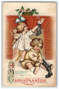 1916 Christmas Children Stockings With Toys Holly Berries Newark NY Postcard 