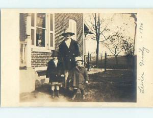 Pre-1930 rppc GIRL AND BOY AND MOM ALL WEARING HATS HM0352