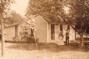 RPPC Antique Couple Colonial House   Real Photo Postcard  c1920