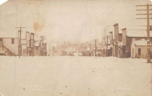 Harrietta Michigan Main Street Winter Snow Real Photo Postcard AA72385