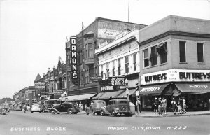 Postcard RPPC 1940s Iowa Mason City Business Block automobiles 23-13884