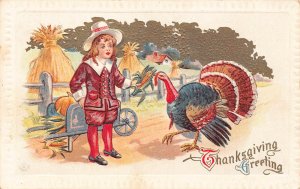Thanksgiving Greeting Peasant Boy Feeds Corn to Turkey embossed postcard B989