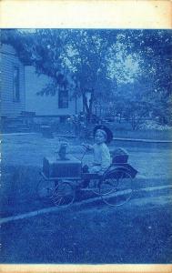 Young Child with Pedal Car Cyan Type Real Photo Postcard