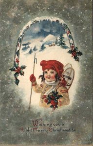 Christmas Child Boy Snow Shoes Holly c1900s-20s Postcard