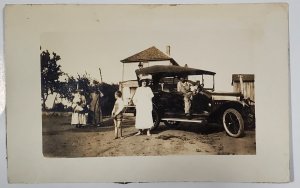 RPPC Family on Farm Showing off Automobile Boy Woman Barefoot Dirt Postcard D28