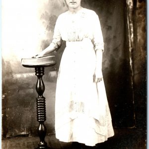 c1910s Cute Young Lady SHARP RPPC Woman Girl Hand on Book Real Photo Hair A161