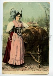 487873 Switzerland girl in national costume Appenzell with a bear Vintage