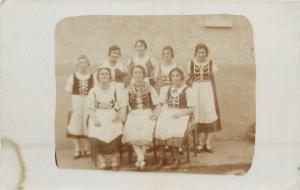 Social history photo postcard group of young women in folk costumes to identify