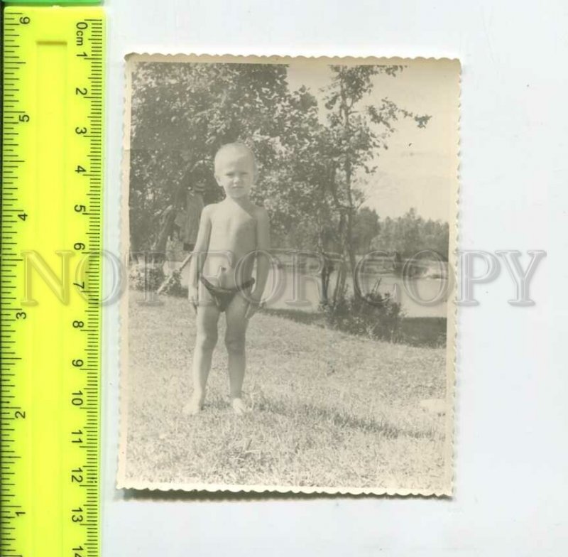 452254 USSR boy sunbathing by the pond Old photo