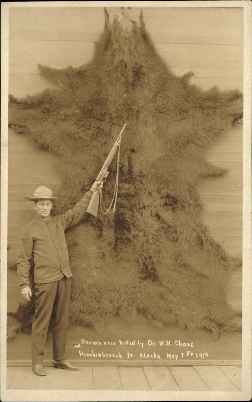 Hunter w/ Gun & Massive Bear Skin Hinchinbrook Island Alaska RPPC