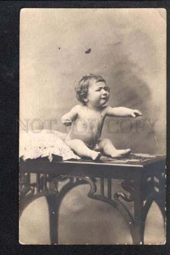 3026247 Little Boy on Table. Vintage Photo PC