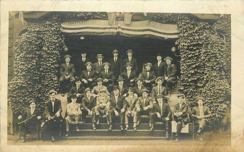 c1910 College Fraternity Men Group Photo Patriotic Flags Ivy Arch RPPC Postcard