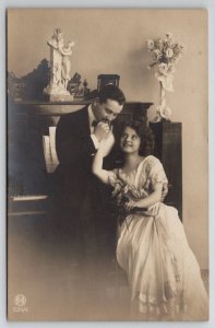 RPPC Love At Piano Dapper Man Pretty Lady with Satyr & Nymph Statue Postcard C36