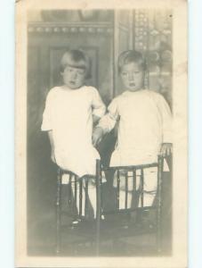 Pre-1920's rppc TWO CUTE KIDS BOTH STANDING ON THE SAME CHAIR o2395