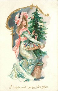 Tuck New Year Postcard 113 Beautiful Lady w/ Christmas Tree & Ornaments in Tray