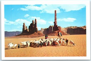 Navajo Women, Taking their sheep to water in beautiful Monument Valley