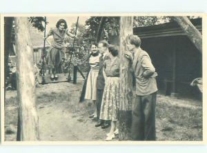 foreign Old Postcard EUROPEAN WOMAN STANDING ON SWING AC2223