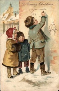 Stewart and Woolf Christmas Boy Draws Graffiti on Wall c1910 Vintage Postcard