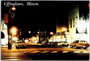 VINTAGE CONTINENTAL SIZE POSTCARD STREET SCENE AT NIGHT AT EFFINGHAM ILLINOIS