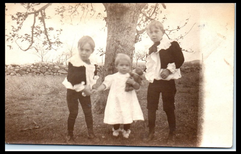 1910s Two Little Boys and Baby with Teddy Bear Velox Stamp Box RPPC Postcard