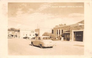 Steele North Dakota Main Street Fire Hall Drug Store Real Photo Postcard AA91937
