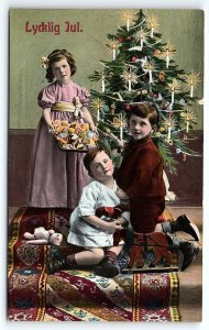 c1910 CHRISTMAS LYCKLIG JUL CHILDREN TREE CANDLES DOLL TOYS POSTCARD P668