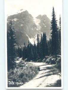 old rppc CAR ON ROAD TO MORAINE LAKE Banff Alberta AB Canada HM1435