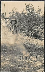 LITTLE BOBBY PLAYING AT CAMPFIRE~SCOUT OR INDIAN OUTFIT-REXO REAL PHOTO POSTCARD