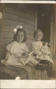 Cute Kids Brother Sister? Boy Holding Doll Girl w/ Pencil & Paper c1910 RPPC 