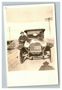 Vintage 1910's RPPC Postcard Antique Auto on Road Man Leaning Against Car
