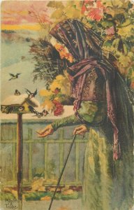 Portrait of an old woman feeding birds vintage postcard artist Maxim Trube