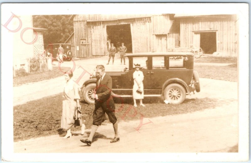 c1920s Odd Parked Car by Barn RPPC Military Men Woman Party Hat Real Photo A134