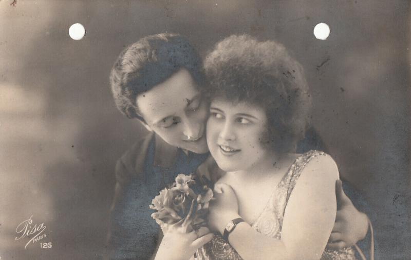 Lovely couple lovers holed/pierced early postcard