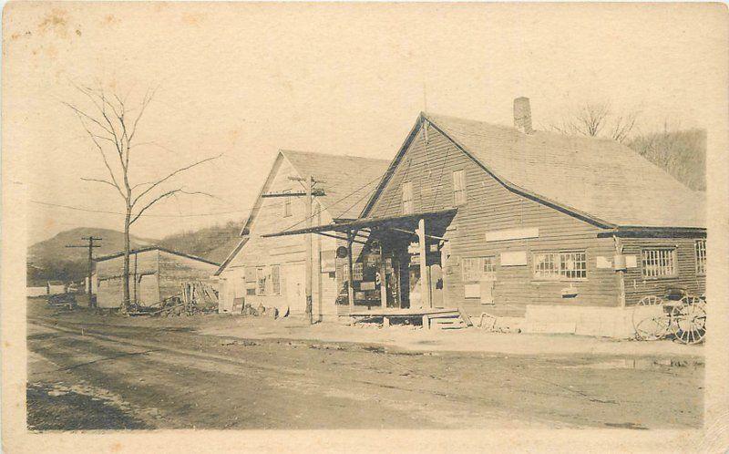 c1910 Rural General Store Livery Advertising Signs Cigarette Hood Tire RPPC