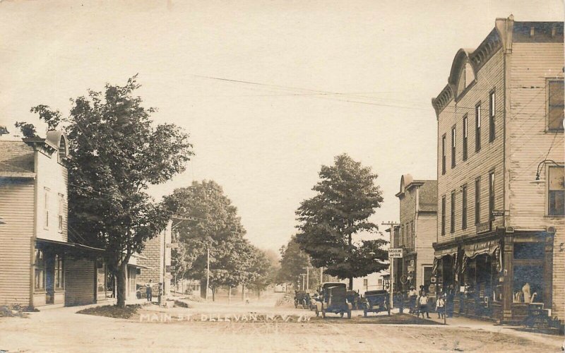 Delavan NY Main Street Storefronts note Photographers Truck Real Photo Postcard