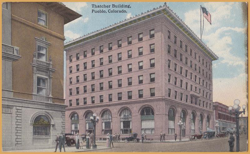 Pueblo, COLO., Thatcher Building, lots of old cars & people milling around