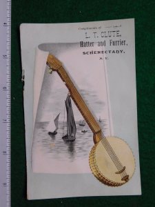 1870s-80s L T Clute Hatter & Furrier Banjo & Sail Boats Victorian Trade Card F30