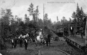 Hauling Cord Wood by Wagon To Railroad Train Logging 1910c postcard