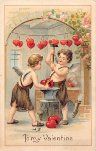 J85/ Valentine's Day Love Holiday Postcard c1910 Cupid Blacksmith 278