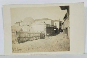 Russia RPPC Street Scene Woman Wood Fence Dirt Roads Old Buildings Postcard O5