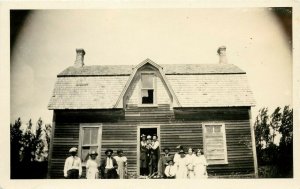 1920s RPPC Postcard; Family Group in front of Wooden House, Winona MN Unposted