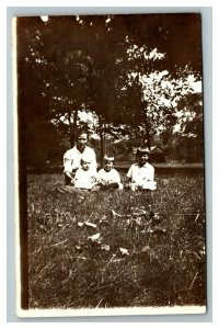 Vintage Early 1920's RPPC Photo of Young Family Sitting on Grass