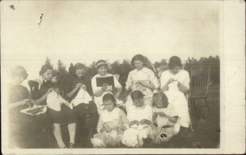 Group of Girls Children Sewing & Reading c1910 Real Photo Postcard