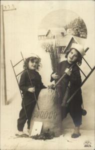New Year - Cute Chimney Sweep Kids & Bag of Money c1910 Real Photo Postcard