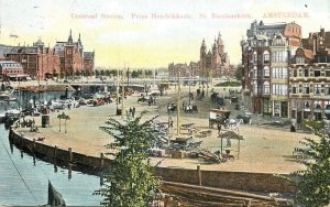 Navigation & sailing themed vintage postcard Amsterdam central station pier boat