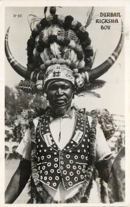 RPPC D-22 Durban South Africa Ricksha Boy in Headdress with Horns & Feathers