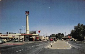 Indio California busy street scene 76 Gas Station vintage pc ZE686276