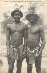 Two Native from the Mankaignes tribe of Senegal smile to show sharpened teeth